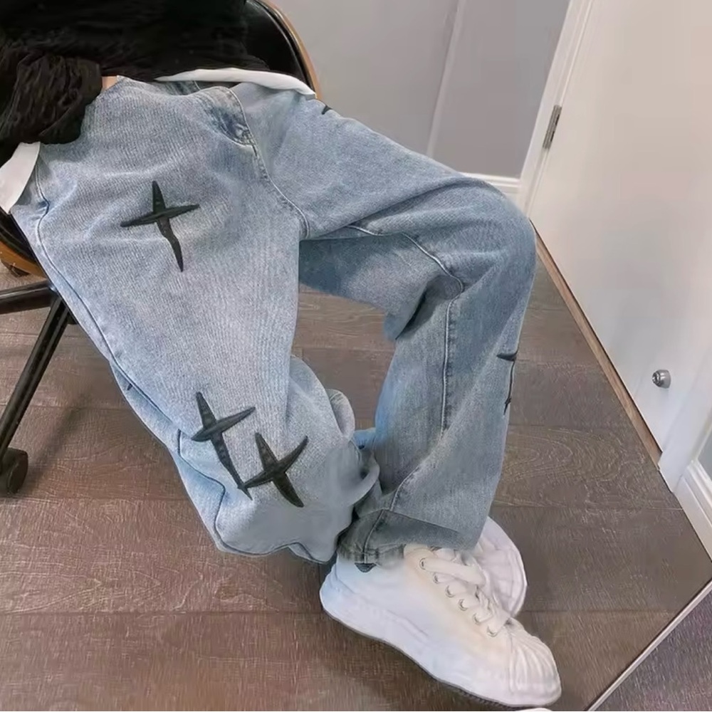 Light Blue Jeans with Black Cross Design